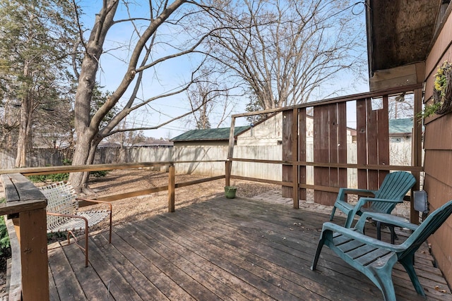 wooden deck featuring a fenced backyard