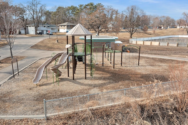 communal playground featuring fence