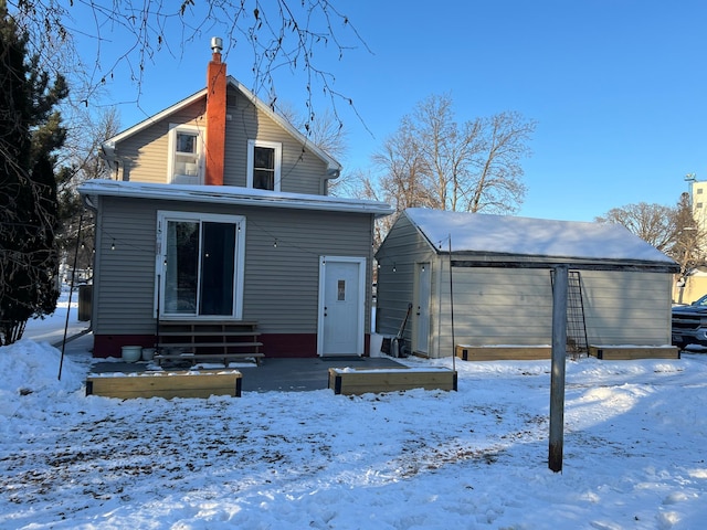 view of snow covered house