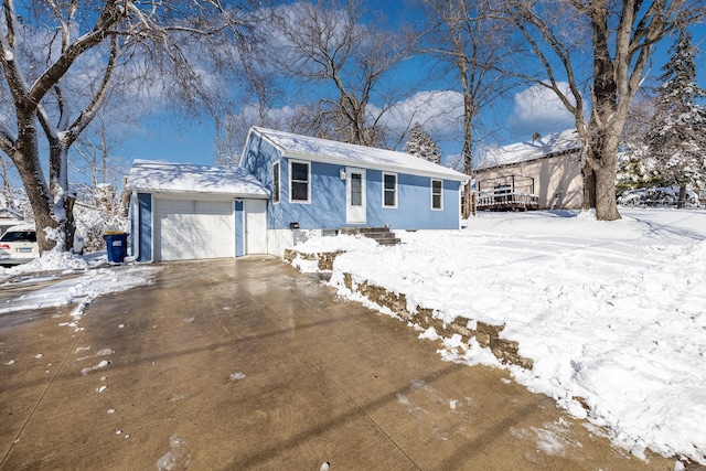 view of front of property with a garage and driveway