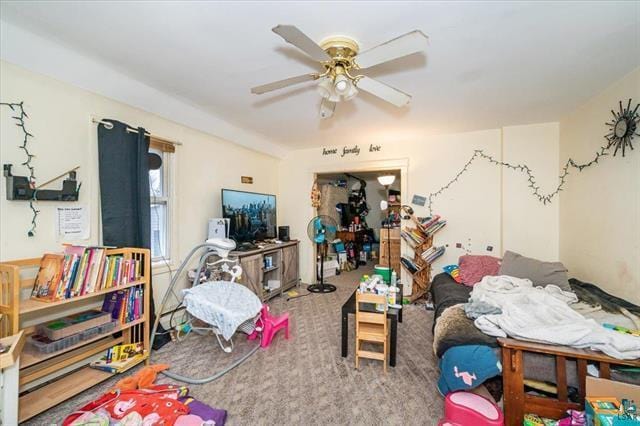 interior space with ceiling fan