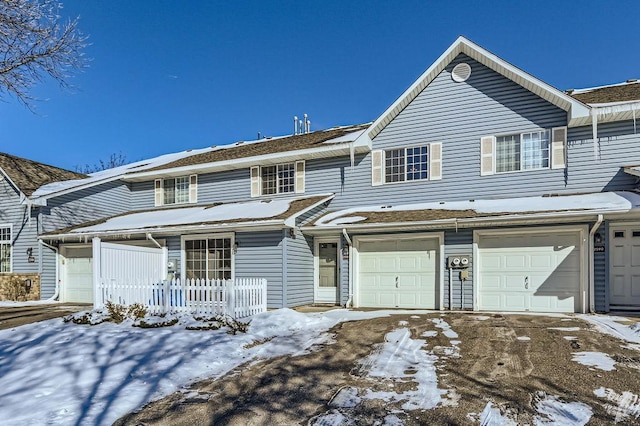 multi unit property featuring a garage