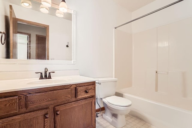 bathroom with washtub / shower combination, vanity, and toilet