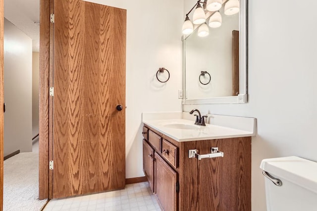 bathroom featuring vanity, toilet, and tile patterned floors