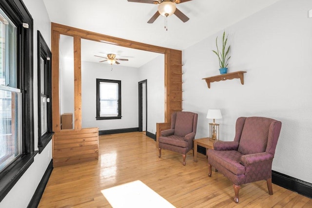 sitting room featuring light wood finished floors and baseboards