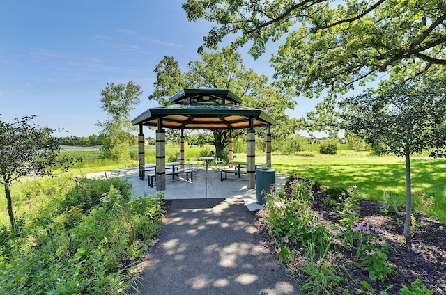 surrounding community with a gazebo, a patio, and a yard