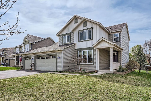 view of front of home with a garage and a front lawn