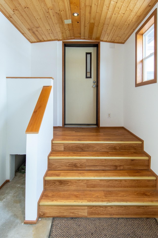 staircase with wooden ceiling