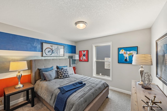 bedroom with carpet floors and a textured ceiling