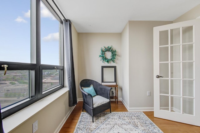 living area with light hardwood / wood-style flooring