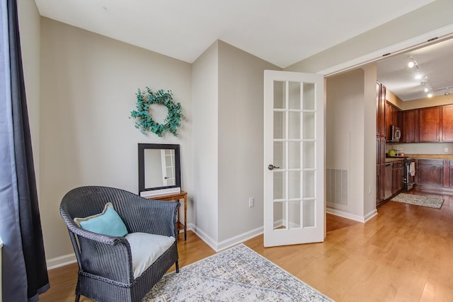 sitting room with light hardwood / wood-style floors