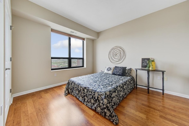 bedroom featuring wood-type flooring