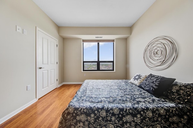 bedroom featuring hardwood / wood-style floors