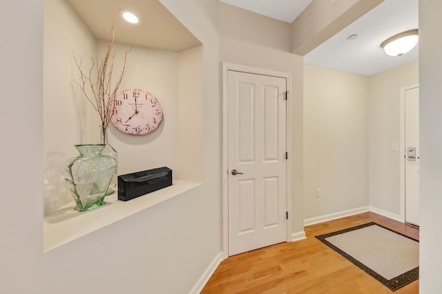 hallway featuring hardwood / wood-style floors