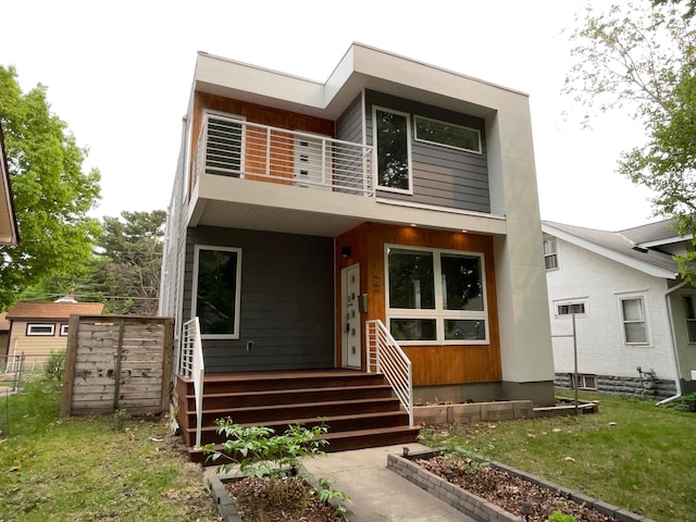 1447 Juliet Ave, Saint Paul, MN 55105 - modern home with a balcony, a porch, and a front lawn