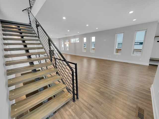 1447 Juliet Ave, Saint Paul, MN 55105 - stairs featuring recessed lighting, wood finished floors, and baseboards