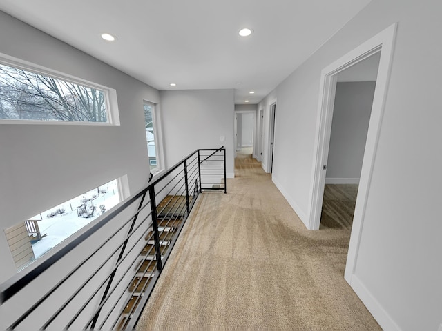 1447 Juliet Ave, Saint Paul, MN 55105 - hallway with an upstairs landing, recessed lighting, light colored carpet, and baseboards