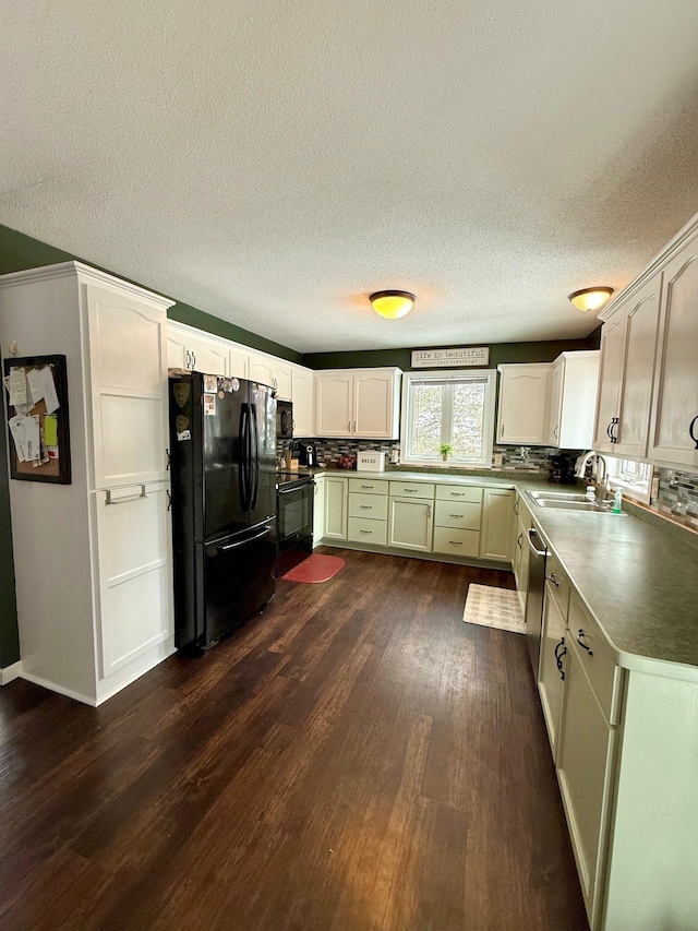 kitchen featuring black appliances, sink, a textured ceiling, dark wood-type flooring, and white cabinets