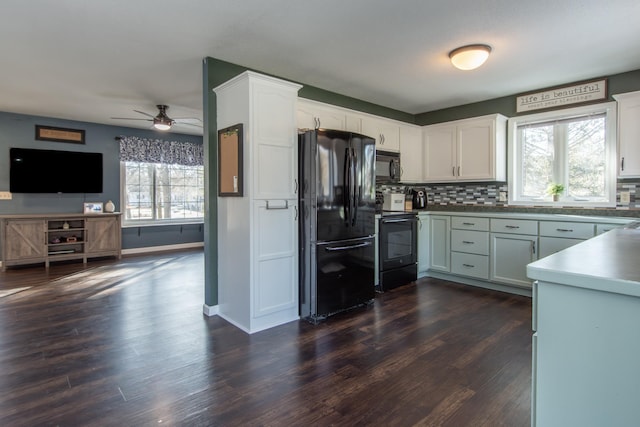 kitchen featuring tasteful backsplash, black appliances, a ceiling fan, and dark wood finished floors