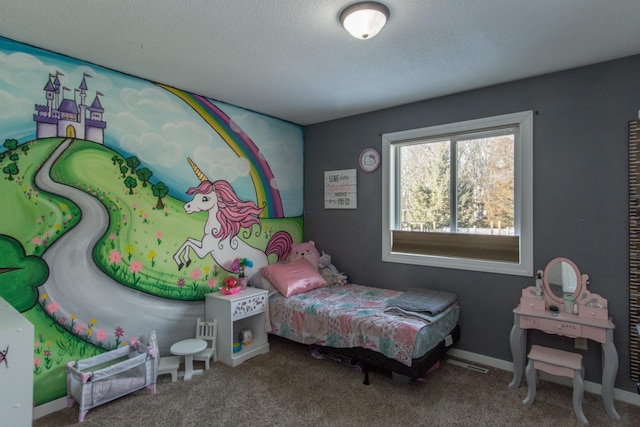carpeted bedroom featuring a textured ceiling