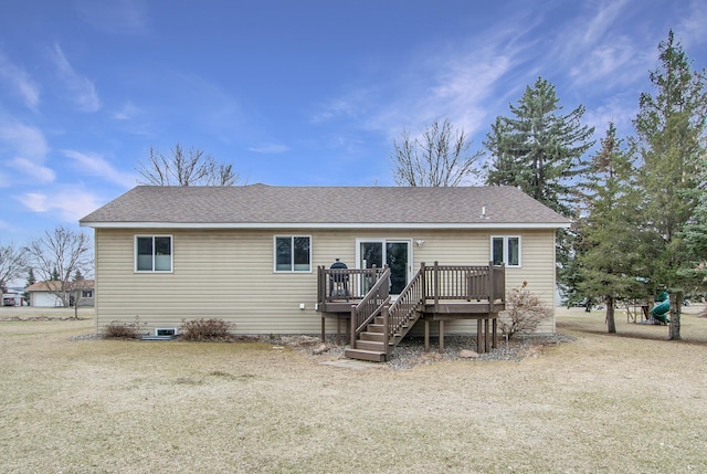 back of house featuring roof with shingles, a wooden deck, and stairs