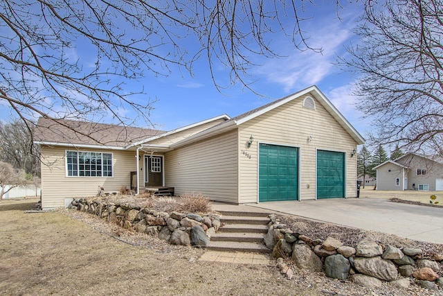 view of front facade with an attached garage and concrete driveway