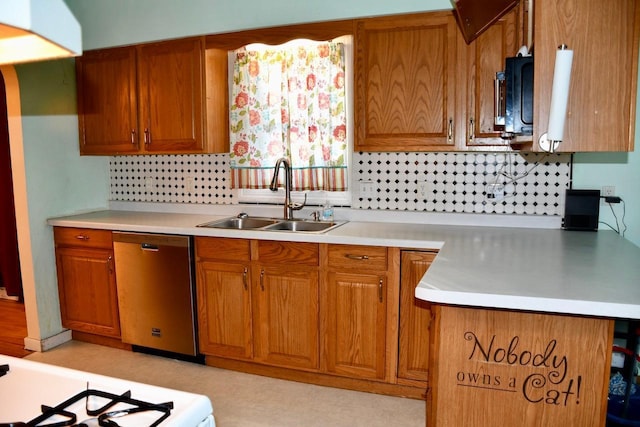 kitchen featuring dishwasher, light countertops, a sink, and brown cabinets