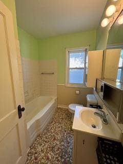 full bath featuring toilet, baseboards, and vanity