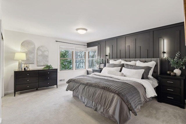 bedroom with light colored carpet