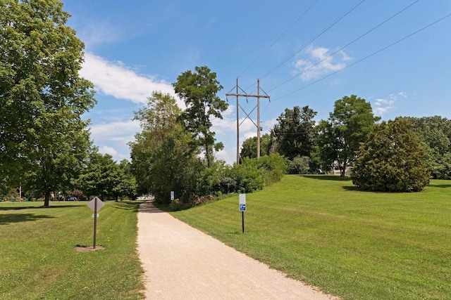 view of home's community with a yard