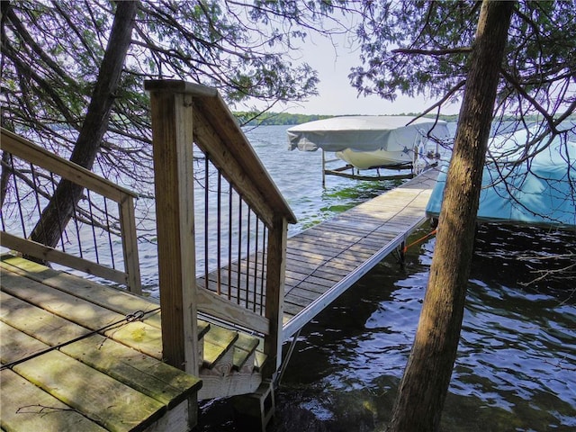 dock area featuring a water view and boat lift