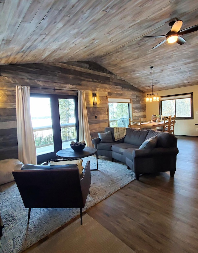 living room featuring wood walls, wood ceiling, vaulted ceiling, and wood finished floors