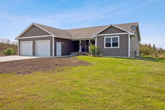 ranch-style house featuring a garage, driveway, and a front lawn