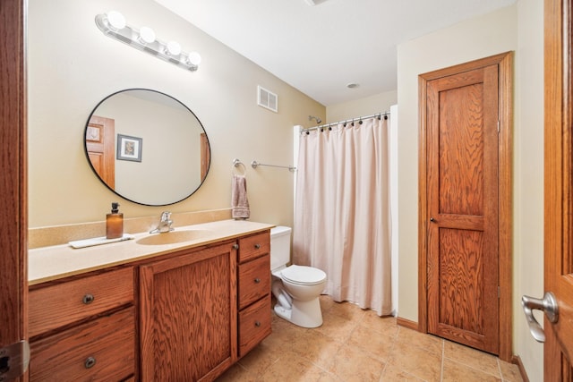 bathroom with visible vents, a shower with shower curtain, toilet, vanity, and tile patterned flooring