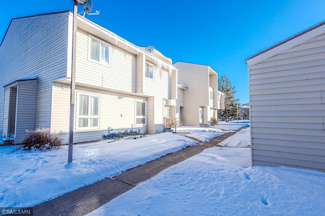 view of snow covered house