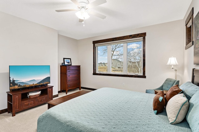 bedroom featuring ceiling fan and light colored carpet