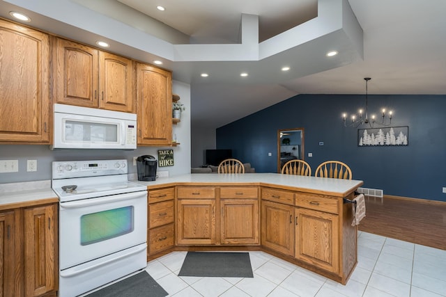 kitchen featuring kitchen peninsula, hanging light fixtures, white appliances, light tile patterned floors, and a chandelier