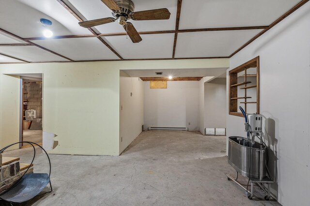 basement featuring a baseboard radiator and ceiling fan