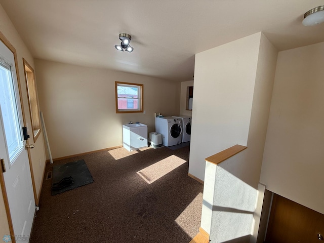 clothes washing area with carpet flooring and washing machine and clothes dryer