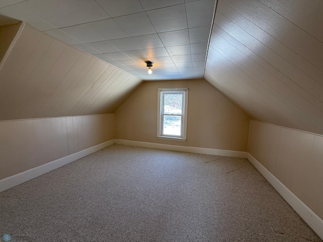 bonus room featuring carpet floors and lofted ceiling