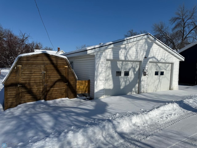 view of snow covered garage