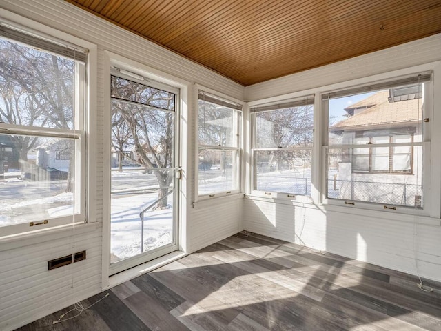 unfurnished sunroom featuring wooden ceiling