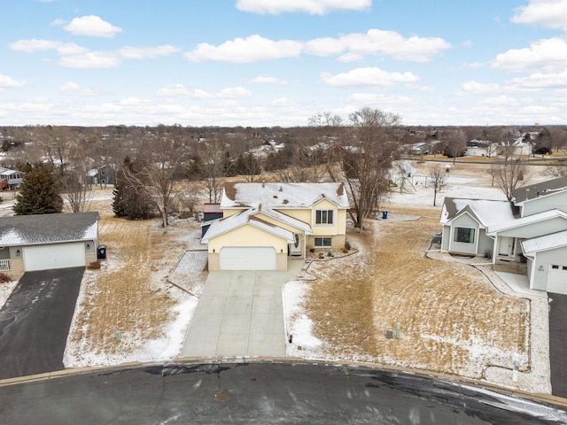 snowy aerial view featuring a residential view