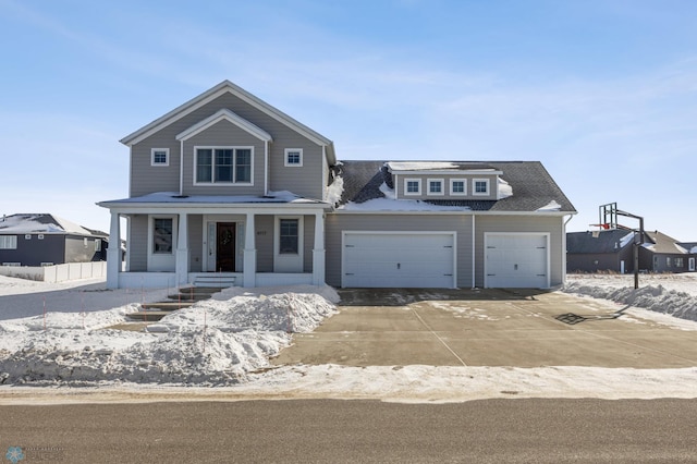 view of front of property with covered porch and a garage