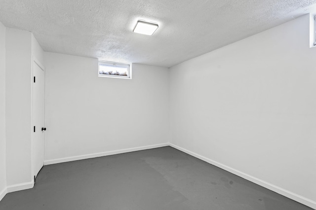 basement featuring a textured ceiling