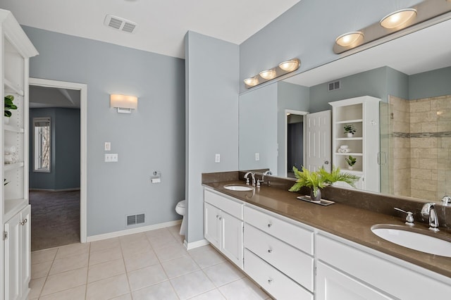 full bathroom featuring a shower stall, visible vents, and a sink