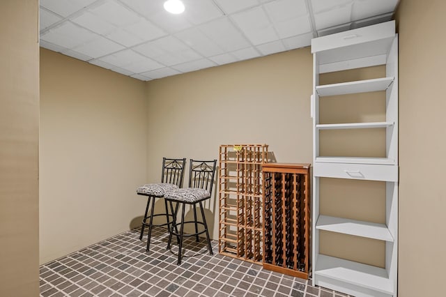 wine area with a paneled ceiling