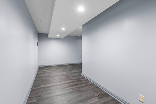 unfurnished room featuring dark hardwood / wood-style flooring