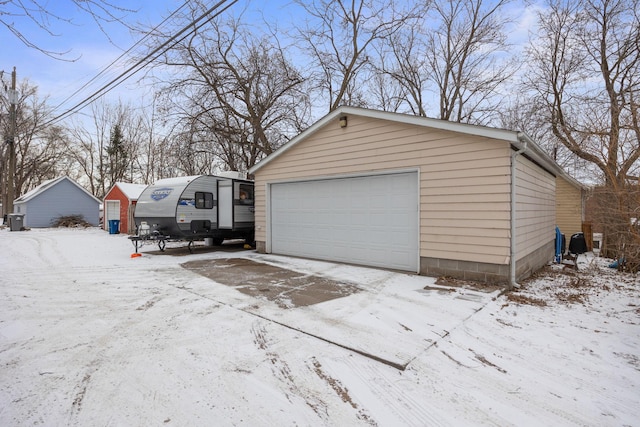 view of snow covered garage