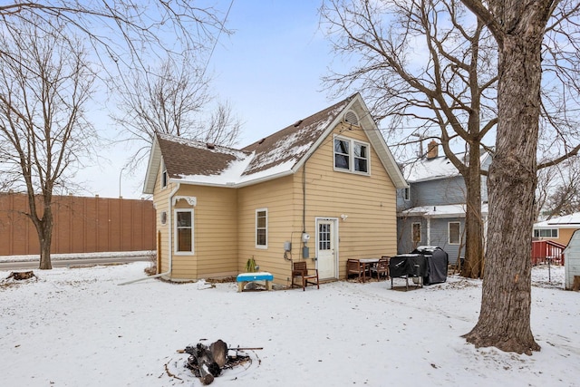 view of snow covered house